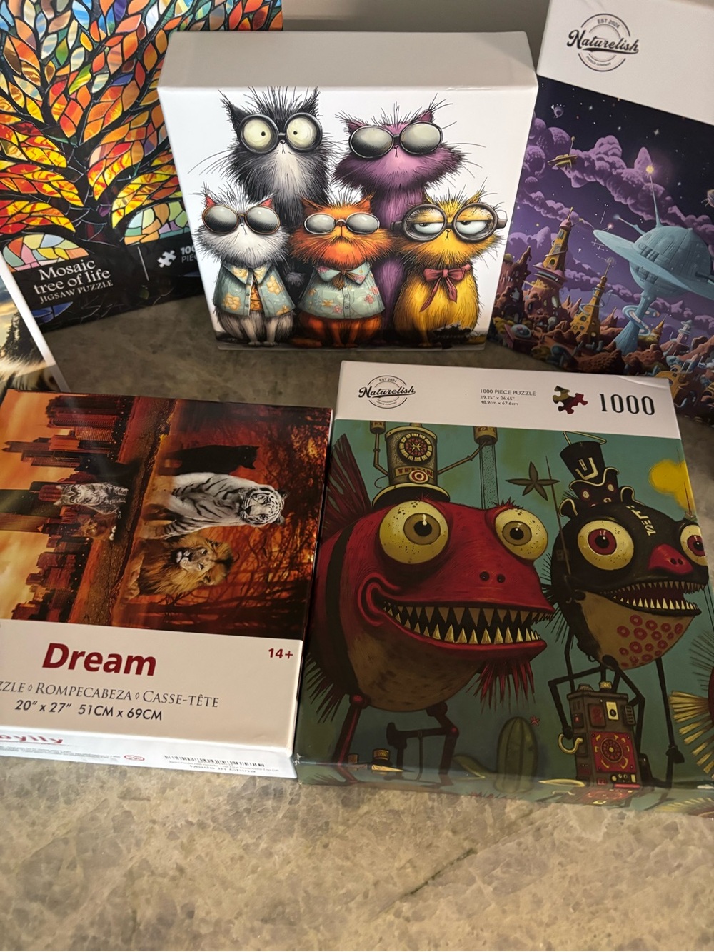 Seven fun, unique 1000 piece puzzles- like new